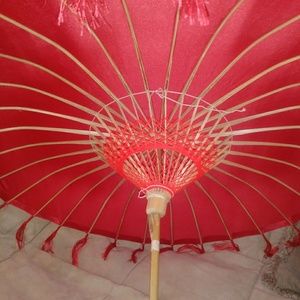 Red satin umbrella. New